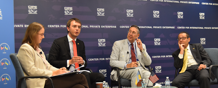From left: moderator Anna Kompanek, and panelists Volodymyr Omelyan, John Herbst, and Matt London