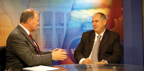 CIPE partner Riinvest President Muhamet Mustafa (right) in interviewed by VOA on the state of reforms in Kosovo.