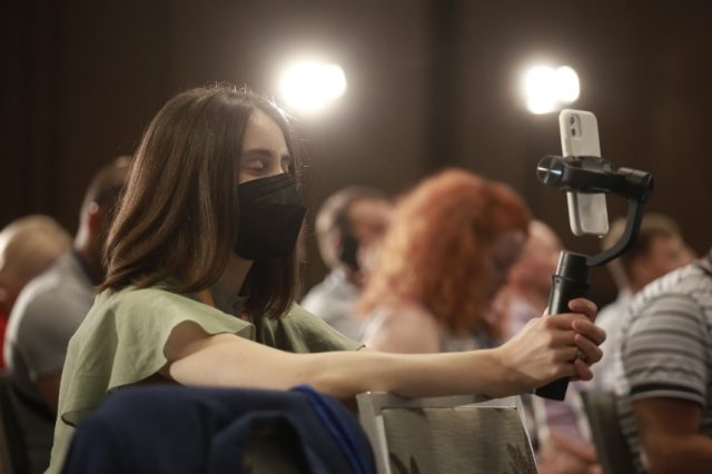 Forum participant recording the speeches